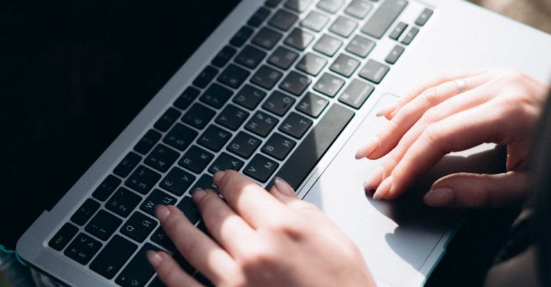 Quantum Computer - Close-up of Woman Holding a Laptop on Her Lap