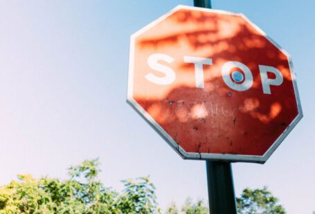 Warning Sign - Red Stop Signage Under Clear Blue Sky