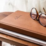 Calendar Update - Calendar and Glasses Lying on Little Wooden Table