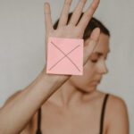 Alert Sign - Woman with paper with cross sign