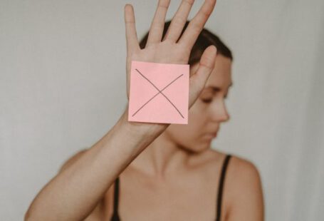 Alert Sign - Woman with paper with cross sign