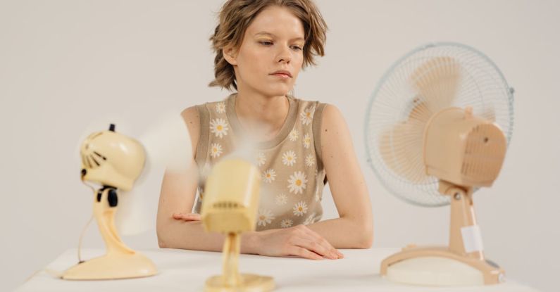 Cooling Fans - Girl Sitting with Fans