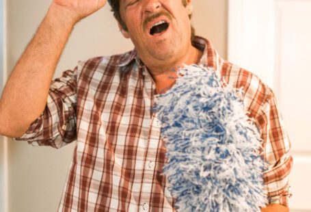 Cleaning Tools - Man in Blue and White Plaid Button Up Shirt Holding Black Cap