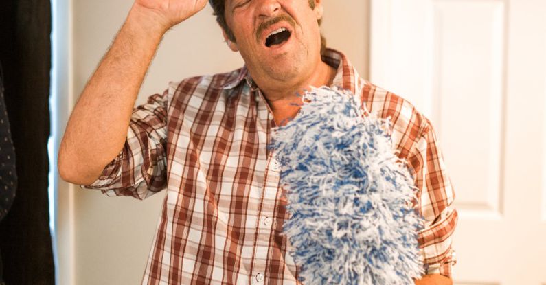 Cleaning Tools - Man in Blue and White Plaid Button Up Shirt Holding Black Cap