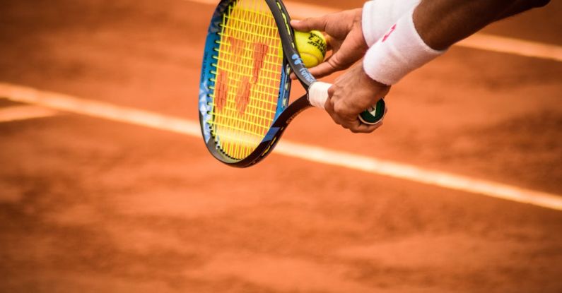 ESD Wristband - Close-Up Photo of Person Holding Tennis Racket and Ball