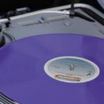Disk Cleanup - A person is holding a purple vinyl record player