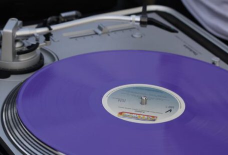 Disk Cleanup - A person is holding a purple vinyl record player