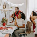 Virtual Desktop - A Group of People Celebrating Christmas Waving on a Video Call