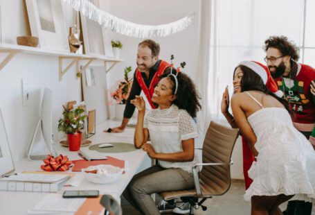 Virtual Desktop - A Group of People Celebrating Christmas Waving on a Video Call