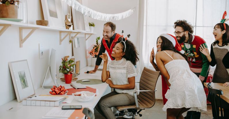 Virtual Desktop - A Group of People Celebrating Christmas Waving on a Video Call